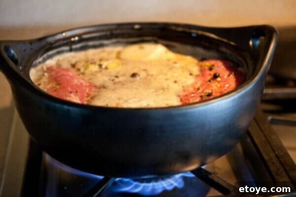 guinness-corned-beef-cabbage-recipe-recipe-7687 cooking pot with guinness corned beef