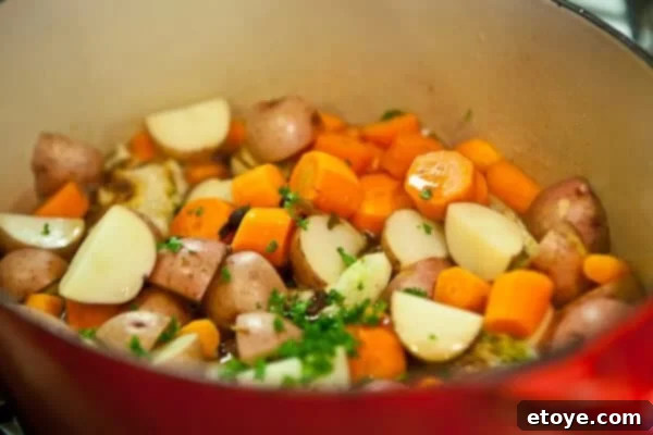The Ultimate Guinness Corned Beef and Cabbage 19 veggies in pot cooking