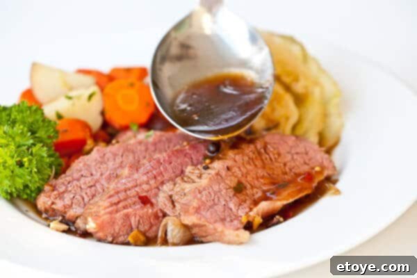 The Ultimate Guinness Corned Beef and Cabbage 21 sauce going onto guinness corned beef