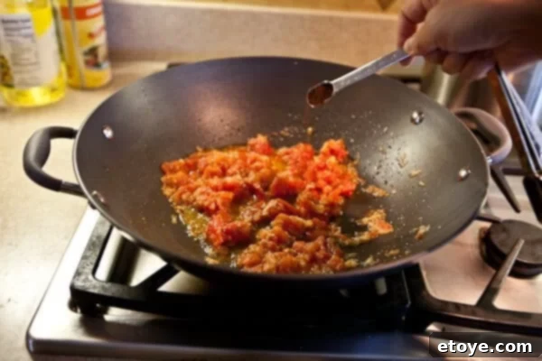 Coastal Indian Fish Curry 11 Garam masala and chili powder added to the curry base