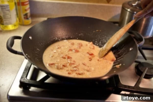 Coastal Indian Fish Curry 12 Coconut milk and water added to the spicy base