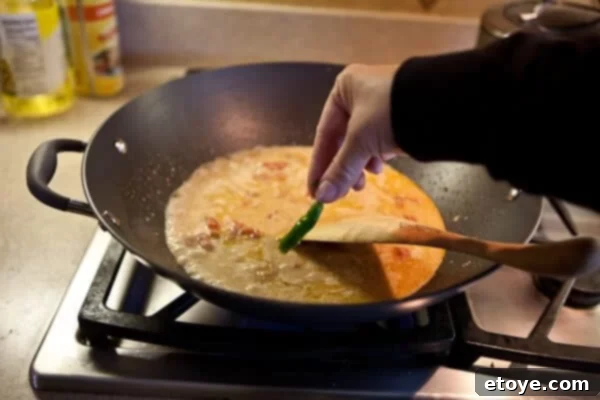 Coastal Indian Fish Curry 13 Halved fresh chili pepper added to the simmering curry