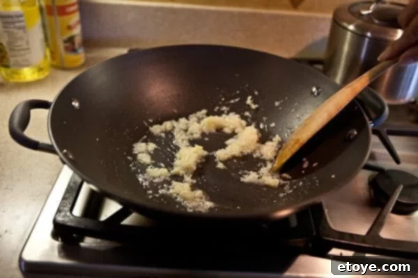 Coastal Indian Fish Curry 8 Cooked aromatics in a pan, turning golden