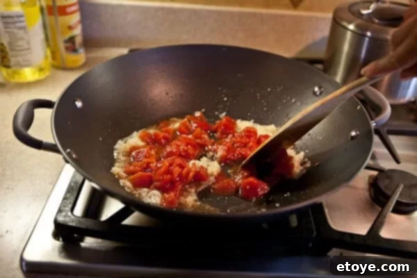 Coastal Indian Fish Curry 9 Diced tomatoes added to the cooked aromatics