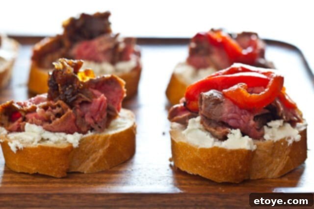 Flank Steak & Chèvre Toasts 2 A vibrant table setting with fresh ingredients, hinting at a culinary journey.