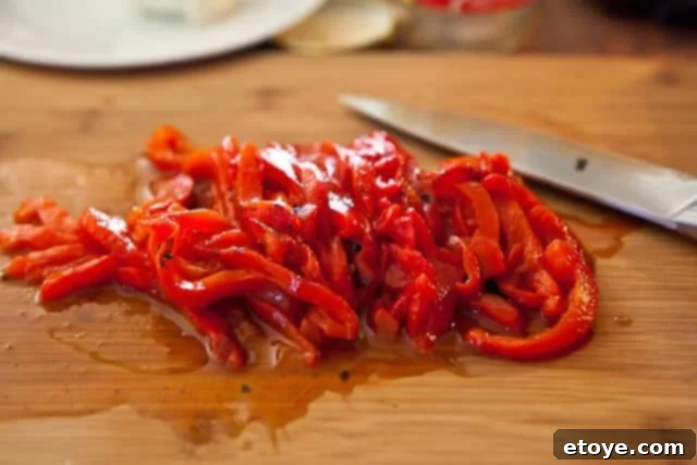 Flank Steak & Chèvre Toasts 14 Thinly sliced roasted red bell pepper arranged on a cutting board.