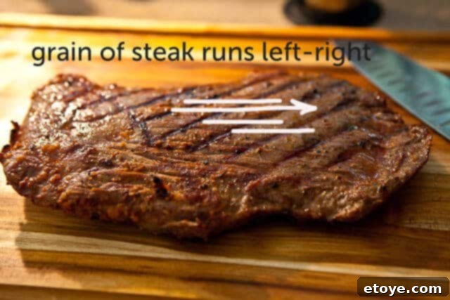 flank-steak-goat-cheese-tapas-recipe-7898 A perfectly grilled flank steak, showcasing its beautiful sear and the visible grain of the meat.