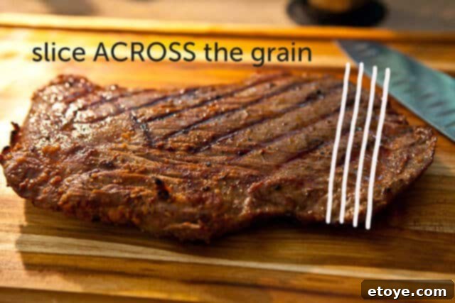 flank-steak-goat-cheese-tapas-recipe-7898-slice Thinly slicing grilled flank steak against the grain, ensuring maximum tenderness.