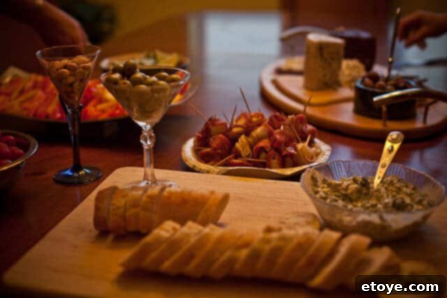 Flank Steak & Chèvre Toasts 5 A collection of delicious Spanish tapas dishes and a bottle of Tapena wine on a table.