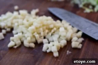 Hearty White Bean and Cabbage Stew 6 Diced potatoes, very small and uniformly cut, in a small bowl.