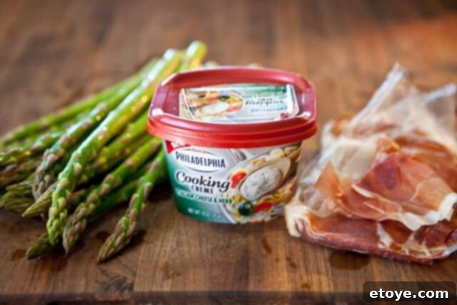 Hand snapping off the tough end of an asparagus spear