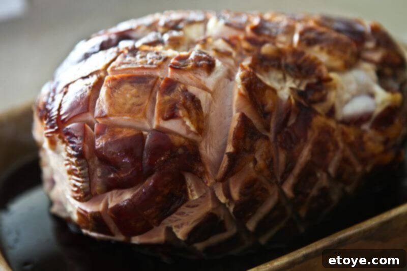 Sweet and Savory Cola Pineapple Glazed Ham 14 Uncovered ham showing the beautiful diamond scoring pattern after initial baking.