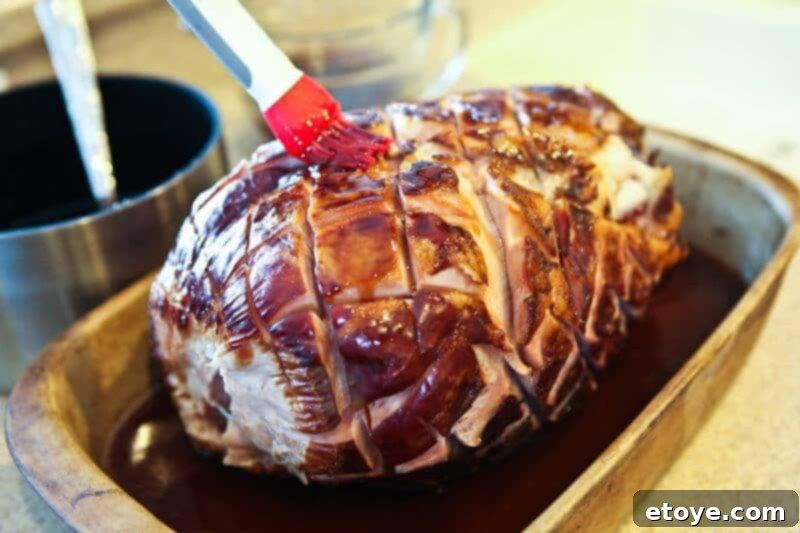 Sweet and Savory Cola Pineapple Glazed Ham 15 Brushing the cola and pineapple glaze generously over the ham.