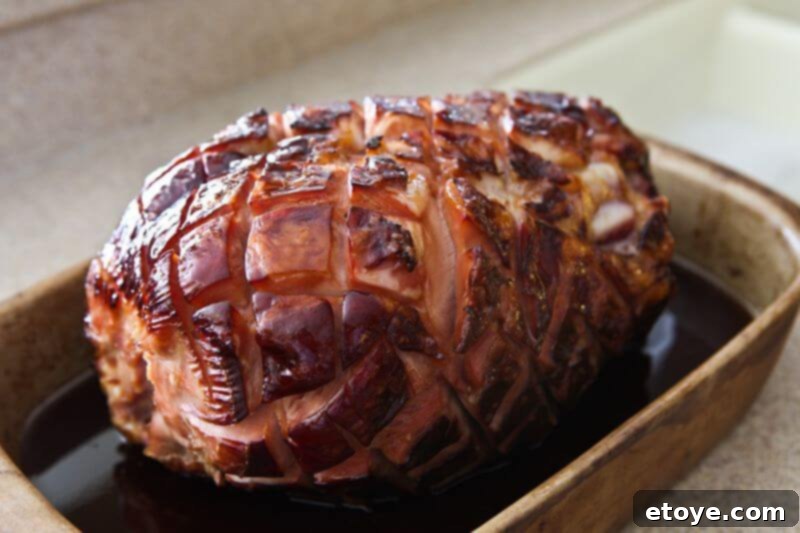 Sweet and Savory Cola Pineapple Glazed Ham 16 Glazed ham baking in the oven at high heat to caramelize the crust.