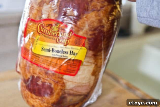 Sweet and Savory Cola Pineapple Glazed Ham 2 Packaged bone-in ham, ready for preparation.