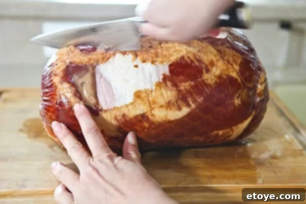Sweet and Savory Cola Pineapple Glazed Ham 4 Scoring the ham's surface with a sharp knife in diagonal lines.