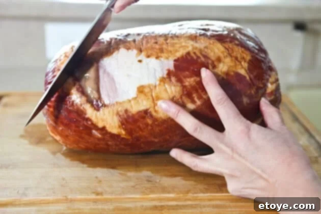 Sweet and Savory Cola Pineapple Glazed Ham 5 Creating a diamond pattern by scoring the ham in the opposite diagonal direction.