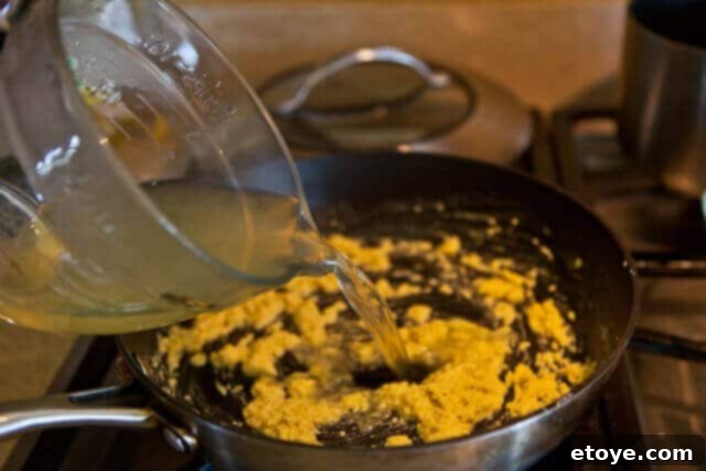 Asparagus Gratin recipe - add broth to roux Asparagus Gratin recipe - add broth to roux