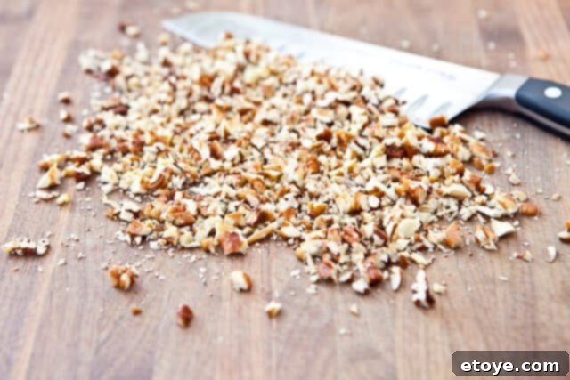 Turtle Cheesecake Pops Truffles Recipe-8369 Chop pecans Turtle Cheesecake Pops Truffles Recipe