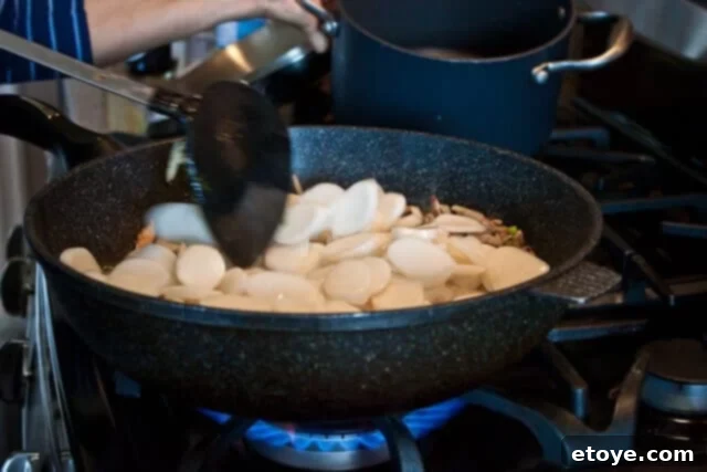 Savory Nian Gao Stir-Fry 14 Sticky rice cakes vigorously tossed with the other stir-fried ingredients.