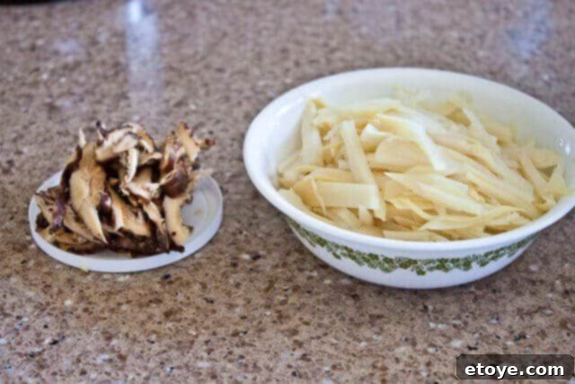 Savory Nian Gao Stir-Fry 5 Shredded Napa cabbage and thinly sliced pork, ready for stir-frying.