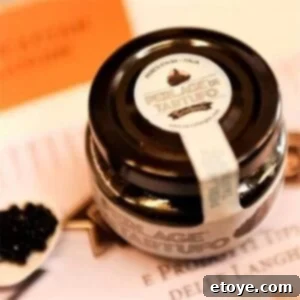 black-truffle-caviar A close-up view of a jar of Chef Shop's Black Truffle Caviar, showcasing its elegant packaging and the rich, dark pearls within.