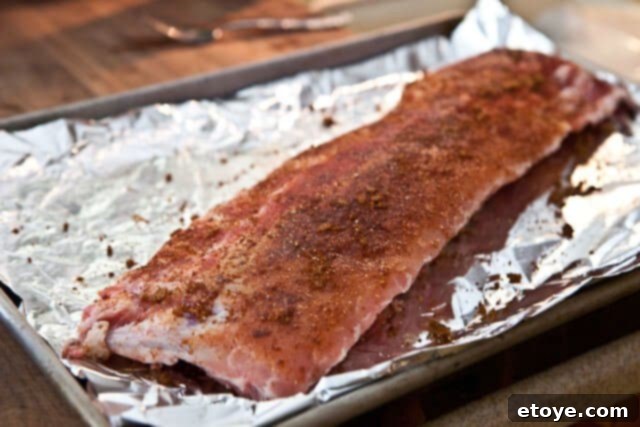 Cayenne Cinnamon Maple Ribs 7 Applying spice rub to baby back ribs