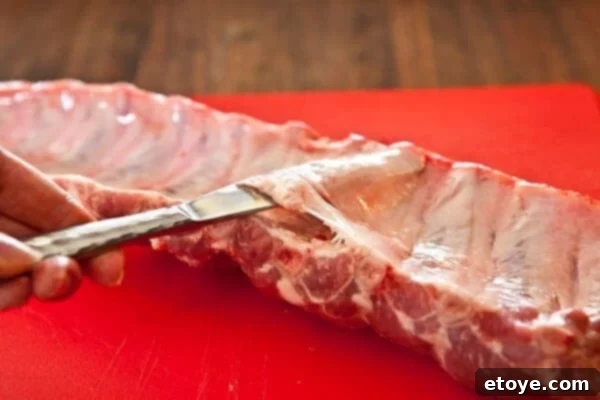 membrane-baby-back-ribs-3 Wedge butter knife between membrane and meat