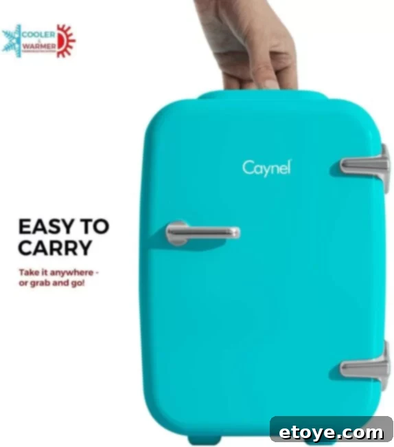 Mini fridge with an ergonomic top handle, demonstrating its portable design for easy carrying.