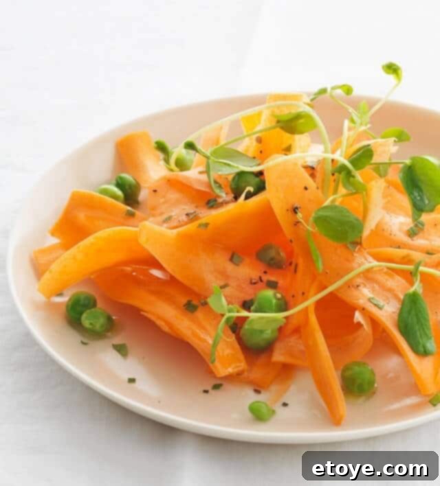Carrot Pea Mint Salad Closeup A close-up shot of the fresh carrot, pea, and mint salad, highlighting its vibrant colors and textures.