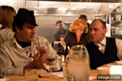 Food writer Greg and restaurant manager Laurent discussing careers at steak tasting