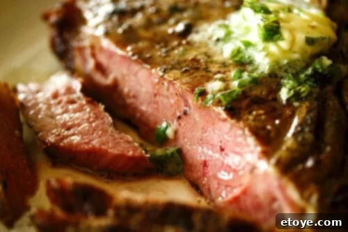 Grilled steak served with garlic-herb butter