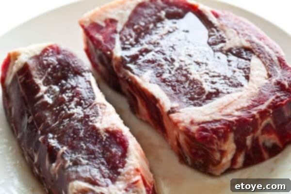Steak after 1 hour of salting, fully glistening with liquid