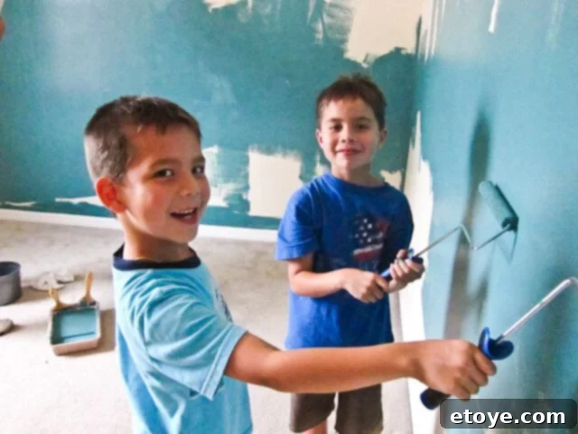 The family (Scott, Jaden, Andrew, Nathan, and Coco the dog) happily posing together in their new home