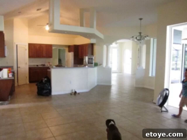 Interior of a house undergoing renovation, with old flooring removed and new materials ready