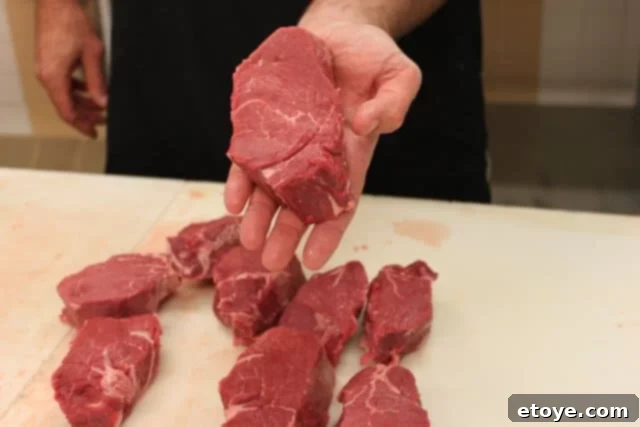 Nine 1¾-inch thick filet mignon steaks neatly arranged on a tray
