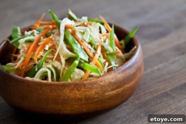 Asian Slaw with Ponzu Sauce Vibrant Asian Slaw with Ponzu Dressing, ready to be served