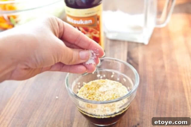 Citrus Ponzu Cabbage Crunch 11 Adding a pinch of salt to the dressing ingredients