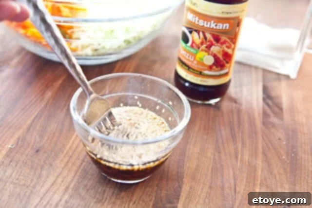 Citrus Ponzu Cabbage Crunch 12 Whisking the ponzu dressing ingredients in a bowl