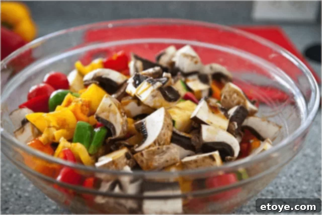 Mushrooms added to vegetables without tossing