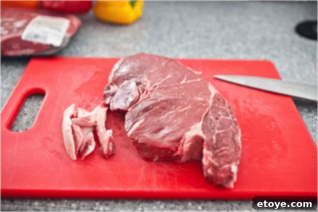 Trimming sirloin steak for kabobs