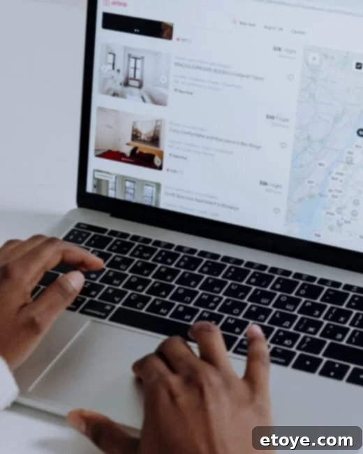 Win a $100 Airbnb Gift Card for Your Staycation 4 A comfortable bed in a minimalist Airbnb bedroom, inviting guests to unwind and enjoy their staycation.