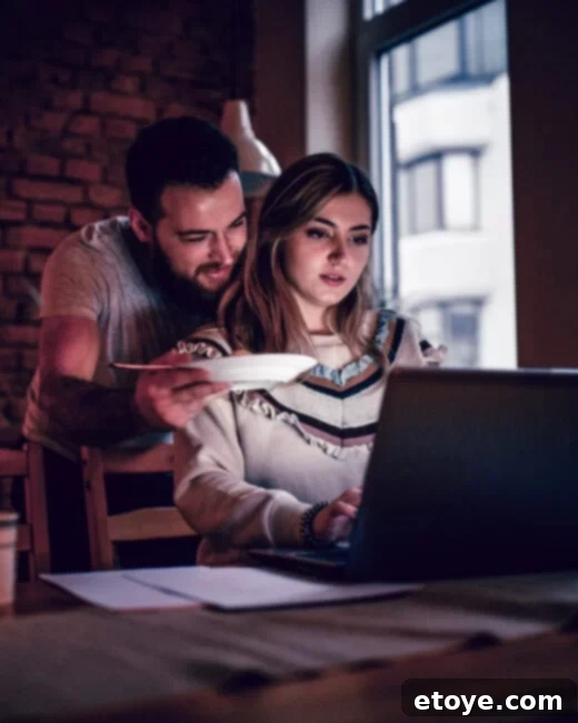Close-up of friends' hands clinking glasses in a toast, symbolizing celebration and camaraderie.