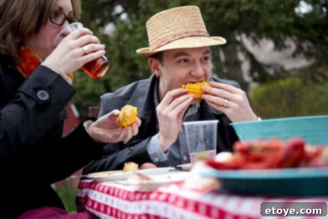 MacheCrawfishBoilEat Guests enjoying a crawfish boil, peeling and eating