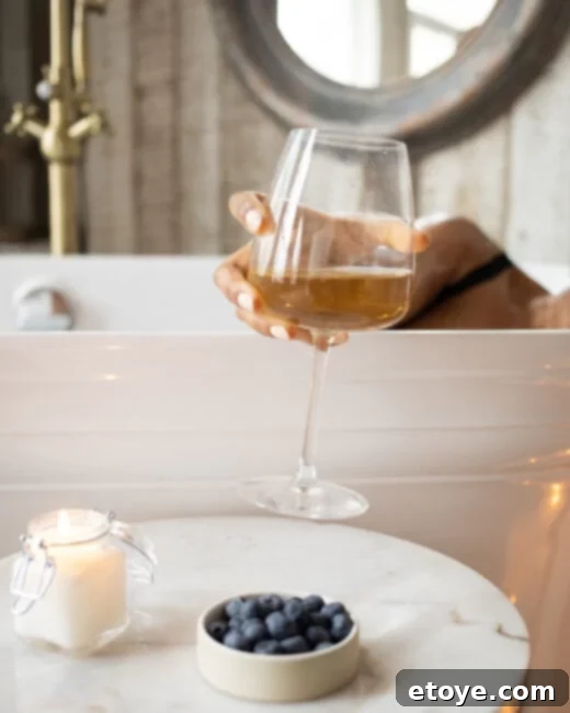 Your Spa Escape A 100 Dollar Gift Card Giveaway 4 Luxurious bath setup with candles, wine, and a book