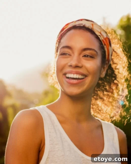 Person smiling brightly, showing gratitude