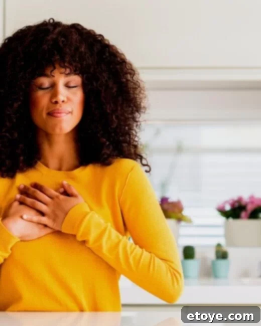 Woman holding cash in hand, looking happy