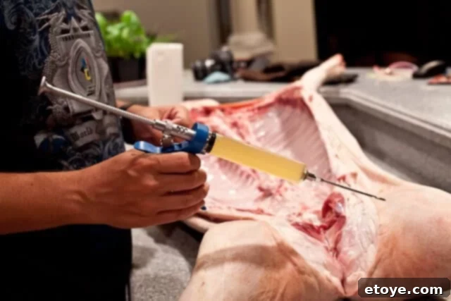 La Caja China Hog Heaven 14 Meat injector in action