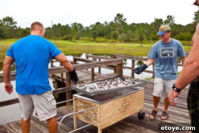 La Caja China Hog Heaven 26 Lifting the metal tray off La Caja China