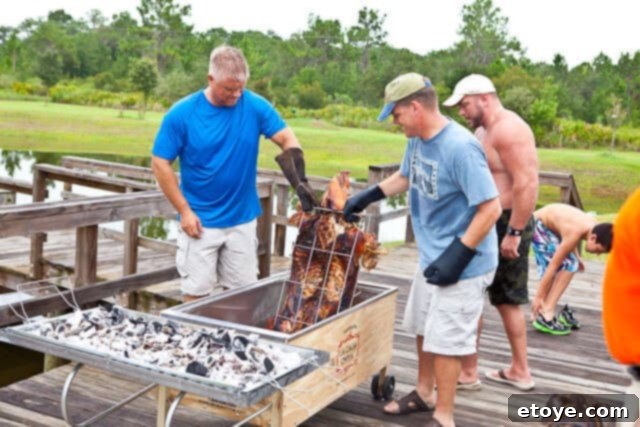 La Caja China Hog Heaven 28 Flipping the pig over in La Caja China